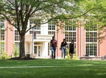 International students from Mauritius walk together outside of the Krapf Gateway Center.